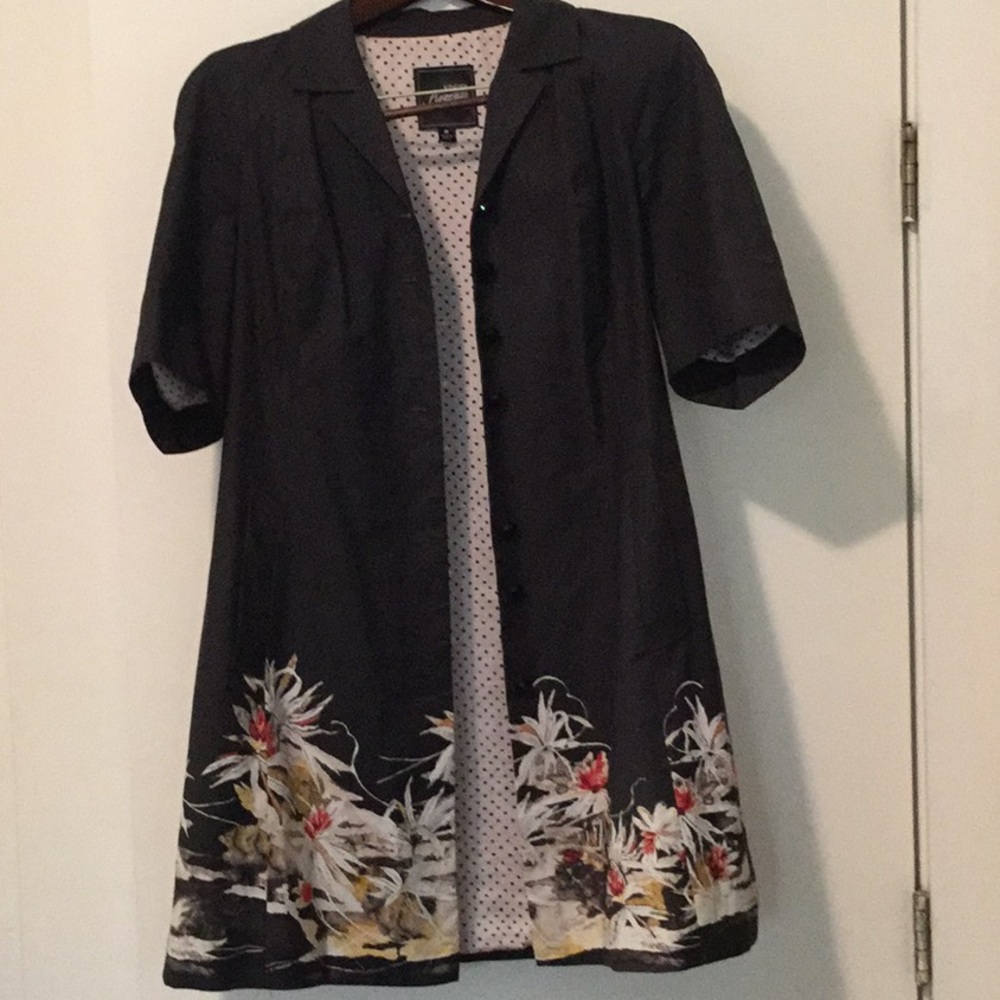 Lined, black, floral patterned, mid length coat.